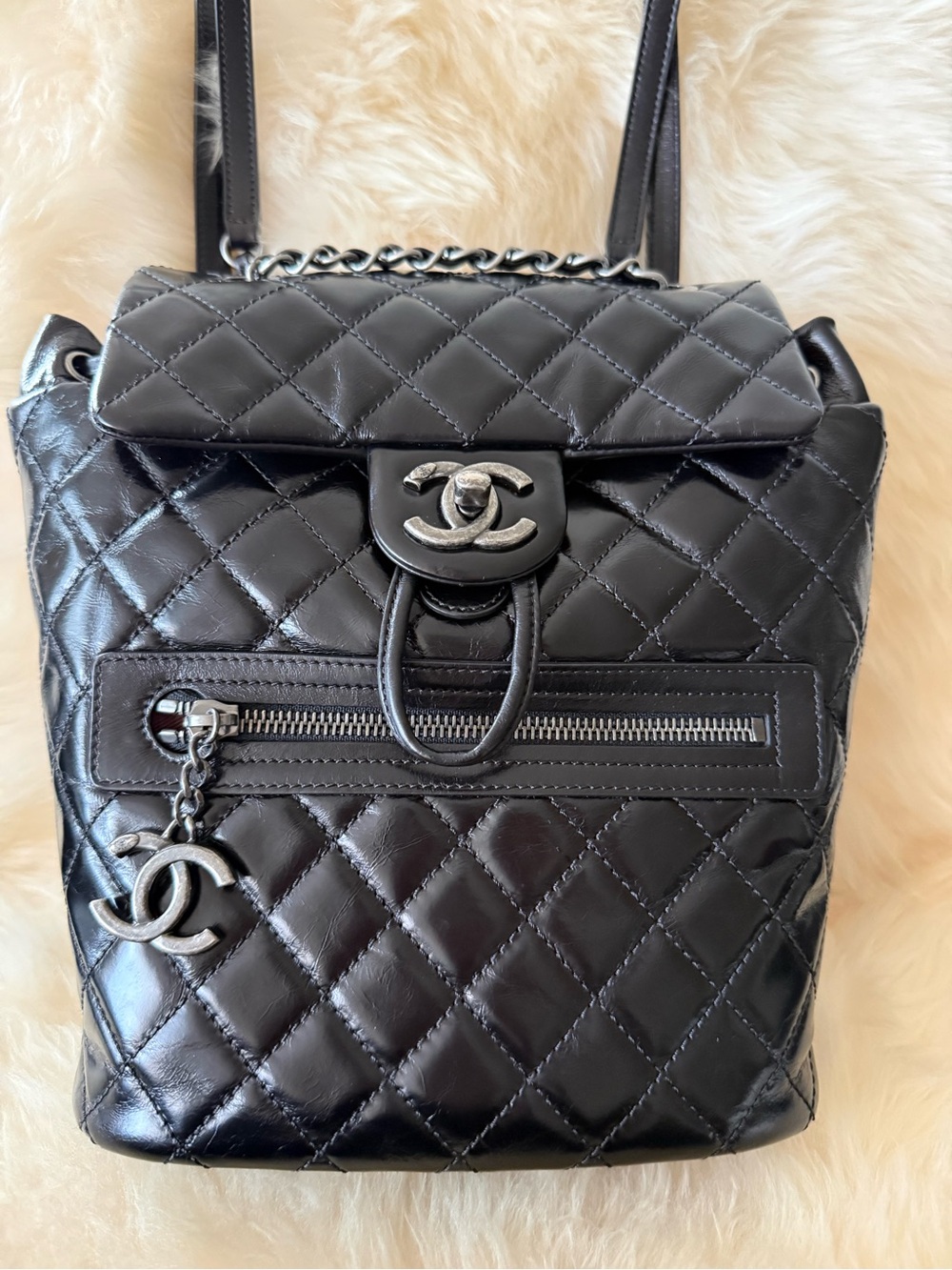 CHANEL Black Quilted aged calfskin Backpack with CC Charm. Mint condition.